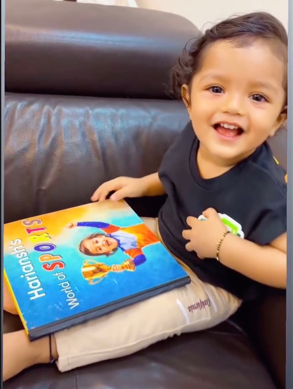 A child holding their finished book